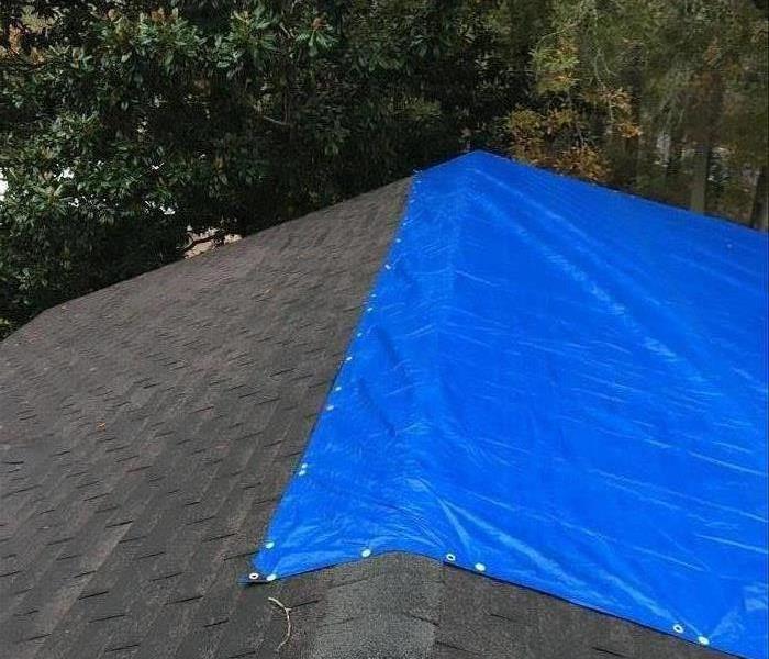 tarped roof on house