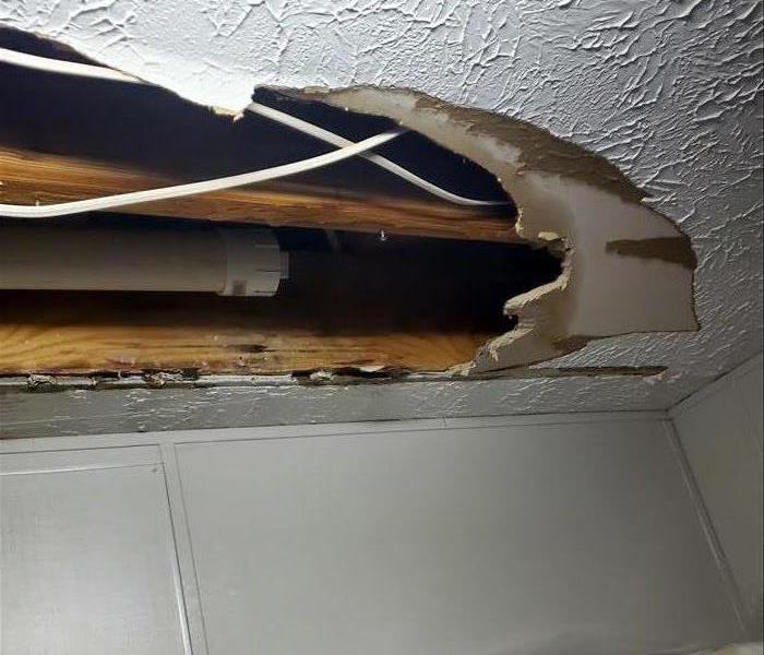 hole in ceiling from water damage
